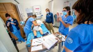 Nursing students working on a dummy